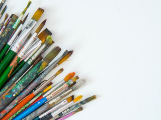 Fototapeta premium many different brushes for painting, artist's working brushes close-up, copy space