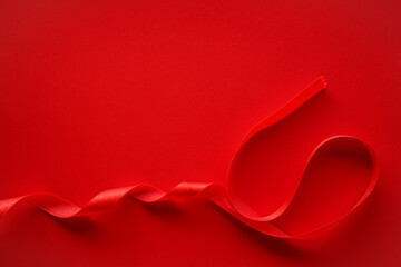 Obraz na płótnie Canvas Red background with red satin ribbon frame, Valentine or Gift background 