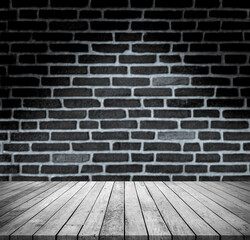 Old black wood plank with abstract blur black brick wall background with shadow for product display 