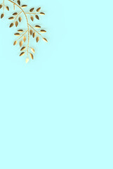 Elegant and minimalist style 3D rendering of golden branches and leaves on soft blue