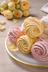 Delicious marshmallows on white wooden table, closeup