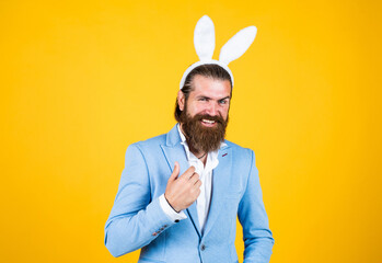 Easter is coming. happy easter. bearded man wear bunny ears. Egg hunt. spring holiday celebration....