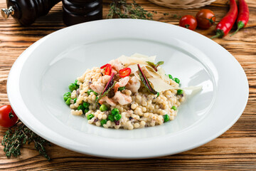italian risotto with shrimps on white plate