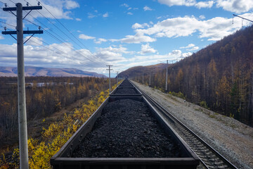 Fototapeta na wymiar Traveling on a freight train with coal along the Baikal-Amur Mainline