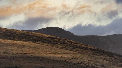 British mountain landscape at dawn with split coloured cloudscape