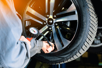 Inflating tire and air pressure in tire fitting.