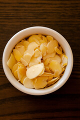 small bowl with filleted almonds close up