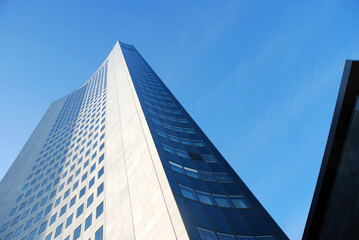 Fototapeta na wymiar Skyscraper blue sky texture architectural view from the streetlevel