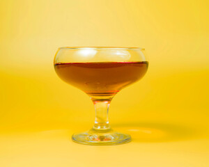 Orange liqueur cocktail on color background with copy space
