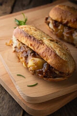 Pulled pork sandwich with melted cheese and BBQ sauce