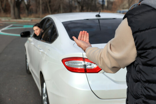 Instructor and student in car during exam on test track. Driving school