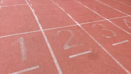 Fototapeta premium The starting point of the sports field track. Concept of competition, victory, winner, loser.