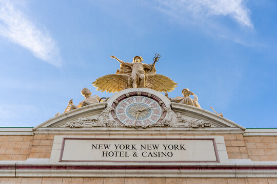 Las Vegas, NV - December 15, 2021: The Glory of Commerce sculpture, depicting Minerva, Mercury and Hercules, and a clock is over the entrance to the New York New York Hotel and Casino.