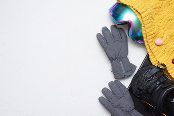 Snowboarding accessories flat lay background with copy space.
