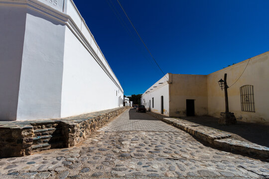 Empty street during the hot midday in the historic center of Cachi