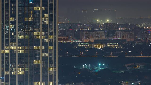 Buildings around Deira and creek district in Dubai night timelapse. Dubai, UAE.