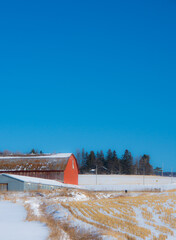 A winter countryside landscape on a farm in the province of Quebec, Canada