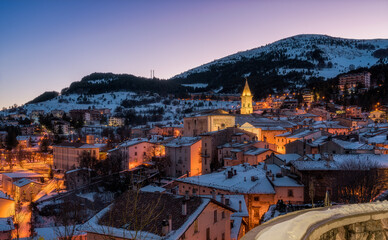 Obraz premium The beautiful village of Pescocostanzo covered in snow and illuminated at night during winter time. Abruzzo, central Italy.
