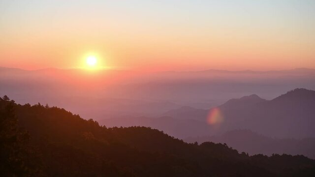 Scenery of Doi Kham Fah viewpoint with sunrise over Doi Luang Chiang Dao mountain with foggy in tropical rainforest at national park