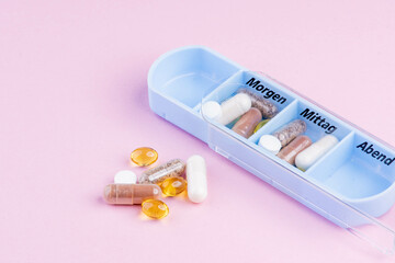 Tablet dosage box filled with nutritional supplements with text space