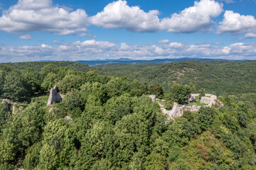 Fototapeta na wymiar Aerial view of medieval castle ruin Szadvar above the village of Szogliget in Northern Hungary along the border with Slovakia, excavated and newly conserved