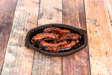 Pork ribs are a special cut of pork, different from the chop. This cut contains the bony parts of the rib cage of the domestic pig, which are called ribs.