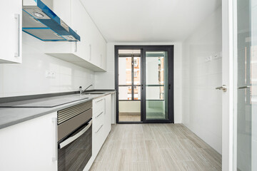 newly installed kitchen in an apartment with access to a terrace to hang freshly washed clothes