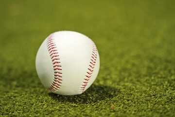 Baseball on neatly mowed grass