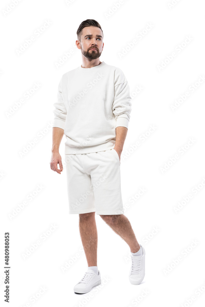 Wall mural Man wearing blank white sweatshirt and shorts on white background