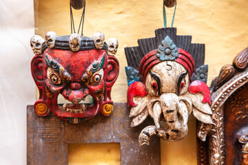 Wooden masks of vibrant colors in Jaisalmer fort street, India.