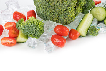 Vegetables on a white background with ice cubes and crushed ice