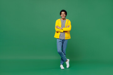 Full size body length cheerful happy fun blithesome young black curly man 20s years old wear yellow...
