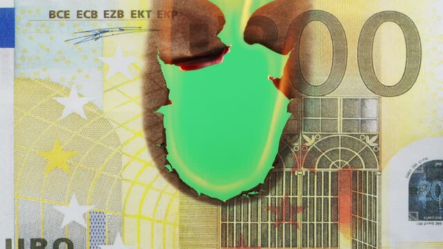 Burning of 200 euro banknote on chroma key bacground close-up. Flame of fire from cash. Financial crisis and depressed economy. Paper money loss concept. 