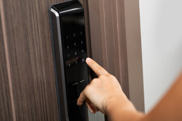 Hand and digital smart code lock into the modern apartment