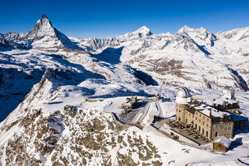 Aerial view of the famous Gornergrat ridge and train station with the Matterhorn peak in Zermatt in...