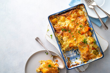 Vegetable gratin with sweet potato, celery, parsnip, carrot, cheese and eggs. Comfort, rustic one...