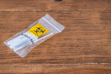 biohazard sachet for throwing away covid-19 test results