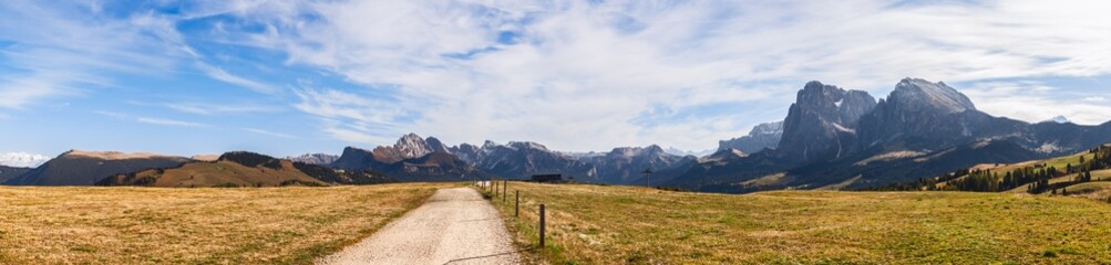 Panorama of Seiser Alm plateau with a scenic road. South Tyrol, Italy.