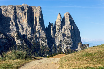 Scenic highland road with Punta Euringer mountain view. Seiser Alm, Italy.