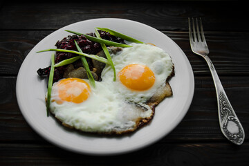 Breakfast fried eggs in lard