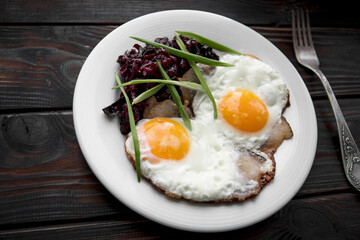 Breakfast fried eggs in lard