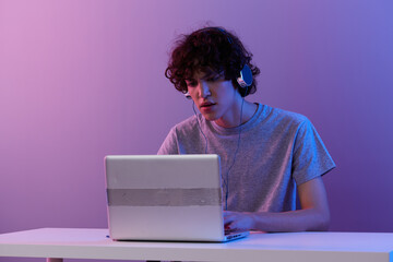 man in headphones in front of laptop entertainment Lifestyle technology