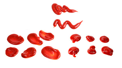 Red sauce splashes isolated on white background. Ketchup.