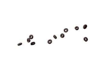 Chocolate rings cereal spill out into a bowl. Breakfast.