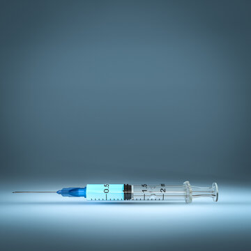 syringe on blue background.