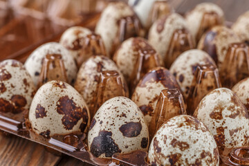 Quail eggs on the wooden plate. Quail eggs can be consumed by frying or boiling. In Indonesia quail...
