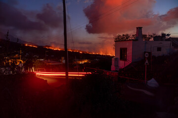 City of El Paso in canary island of La Palma glowing orange due to the lava streams in the...
