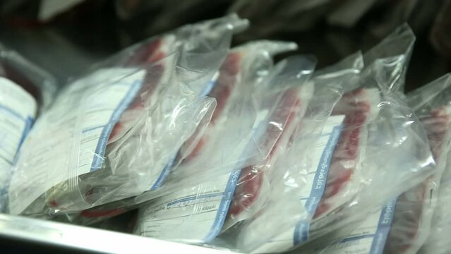 Open refrigerator for storing packages with frozen blood