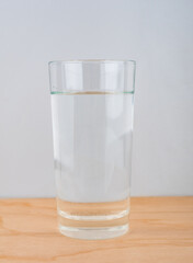 Water glass close up on wooden background