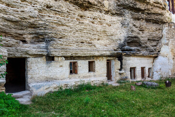 Rocky monastery with cells for monks. Background with copy space